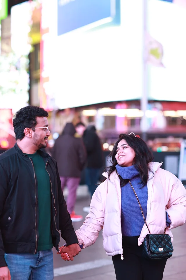 Akanksha and Kushal holding hands in Times Square