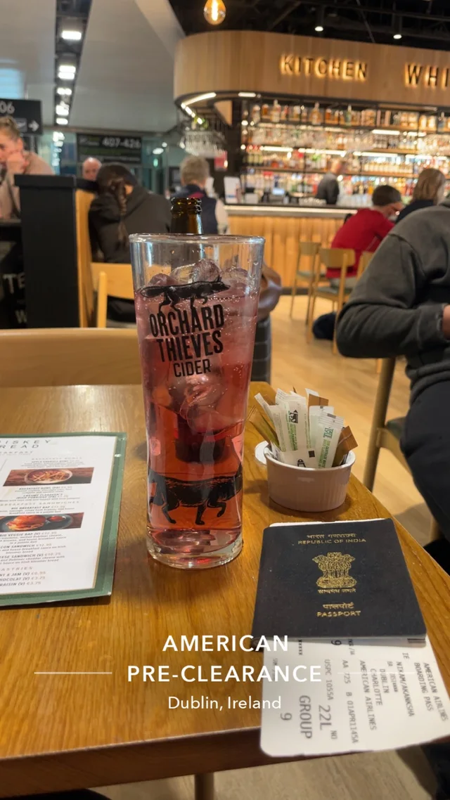 Passport and boarding pass on an airport café table