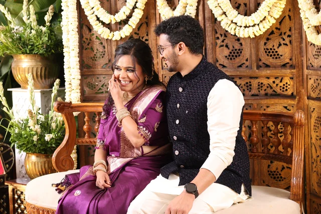 Akanksha and Kushal laughing together in traditional Indian outfits